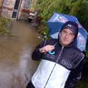 Lee Neath outside his Whittington Street, Doncaster, rented home which is surrounded by flood water. It was flooded during the last heavy downpour of rain, and he was expecting it to be flooded once again.