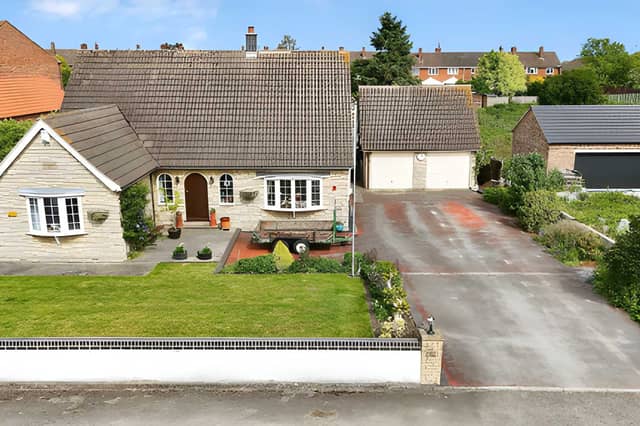 The property is set along a private road and at the head of a large yard area