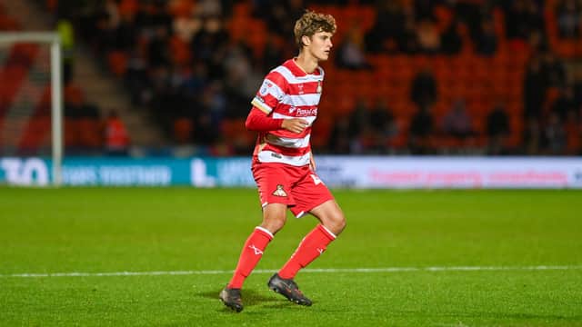 Jonny Tomlinson made his Doncaster Rovers' debut against Huddersfield Town in the EFL Trophy.