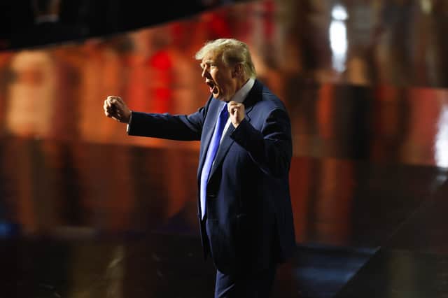U.S. President Donald Trump dances as he departs after addressing attendees on the first day of the 2026 Republican National Convention at the American Airlines Center.