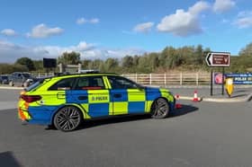 The scene at Yorkshire Wildlife Park which has been evacuated and closed due to an ongoing emergency incident - with a huge police and paramedic presence at the site. Photo: SWNS