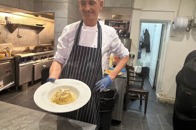 Chef Leo in the kitchen making pasta.