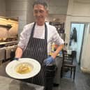 Chef Leo in the kitchen making pasta. 