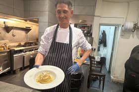 Chef Leo in the kitchen making pasta. 