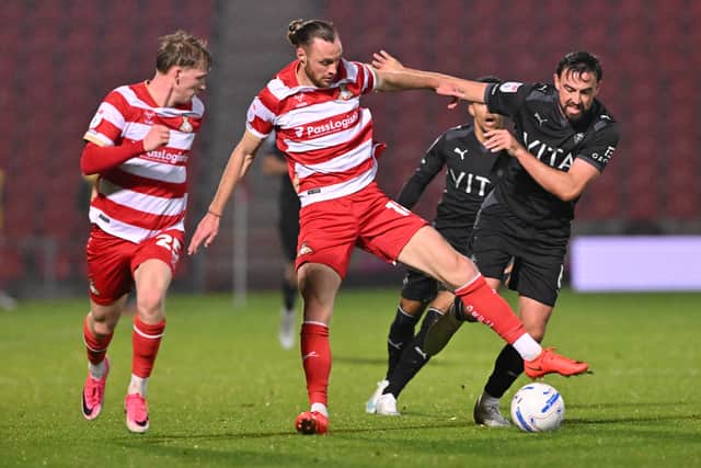 Doncaster's  Will Keane in action against Stockport County