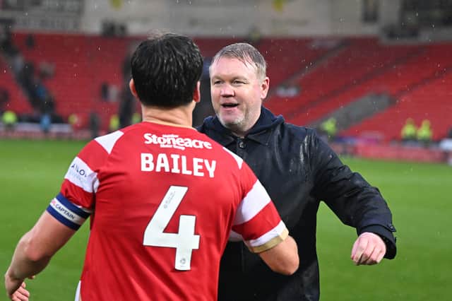 Grant McCann celebrates the win with goalscorer Owen Bailey