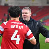 Grant McCann celebrates the win with goalscorer Owen Bailey