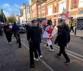 Anti-illegal immigration protesters march along Hall Gate.