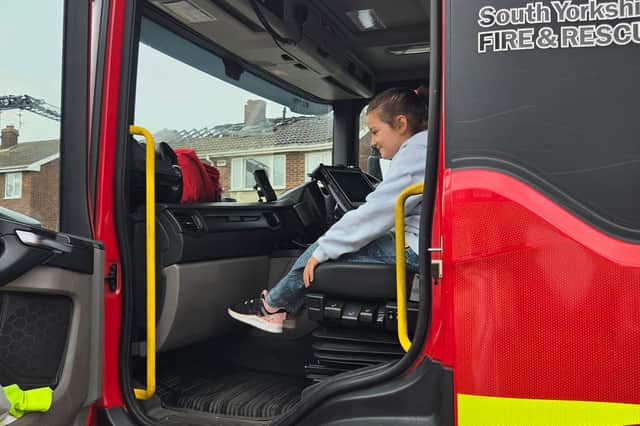 The youngster got a look inside a fire engine following the blaze.