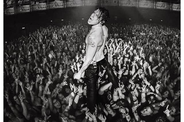 The exhibition features dozens of images of Yungblud on his Idols tour