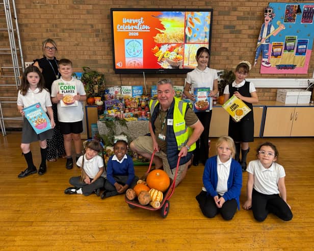 Sean Gibbons collects the harvest festival produce for the food bank