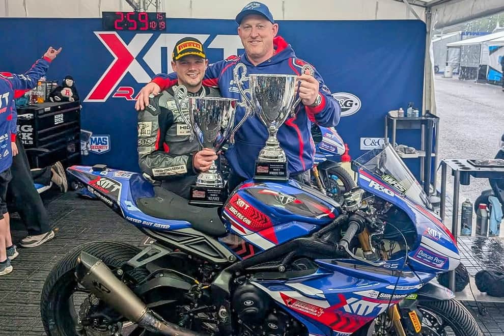 Luke Jones with his Quattro Group British Supersport 1st place trophy along side Team Owner Chris Hicks proudly displaying the Winning Teams trophy. 