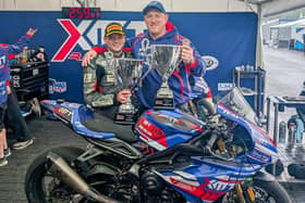 Luke Jones with his Quattro Group British Supersport 1st place trophy along side Team Owner Chris Hicks proudly displaying the Winning Teams trophy. 