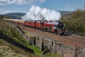 Letting off steam ... an historic locomotive hauls the train over the Settle-Carlisle line 