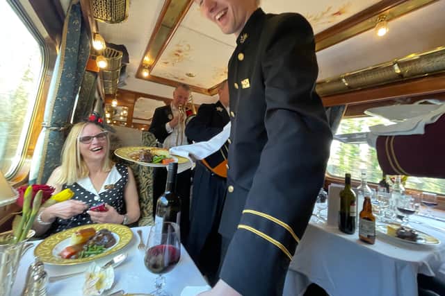 Lunch is served ... a passenger prepares to tuck in while musicians play in the background