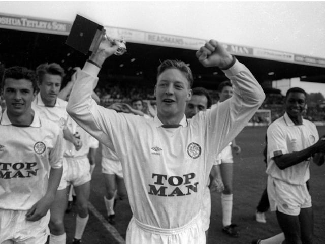 A fresh-faced David Batty gets his hands on the Second Division trophy as the players enjoy a lap of honour.