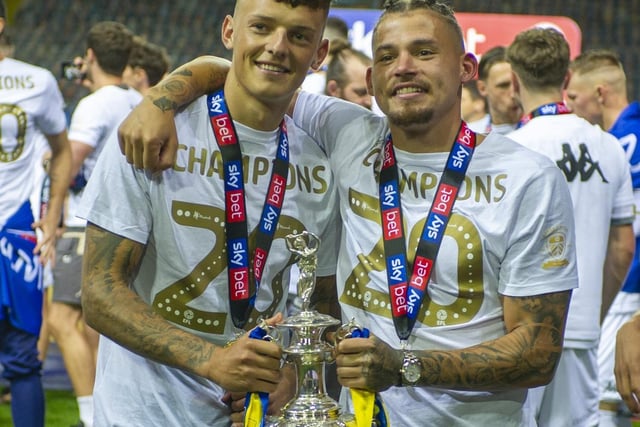 Ben White and Kalvin Phillips lift the championship trophy at Elland Road, winning the division and promoted to the Premier League.