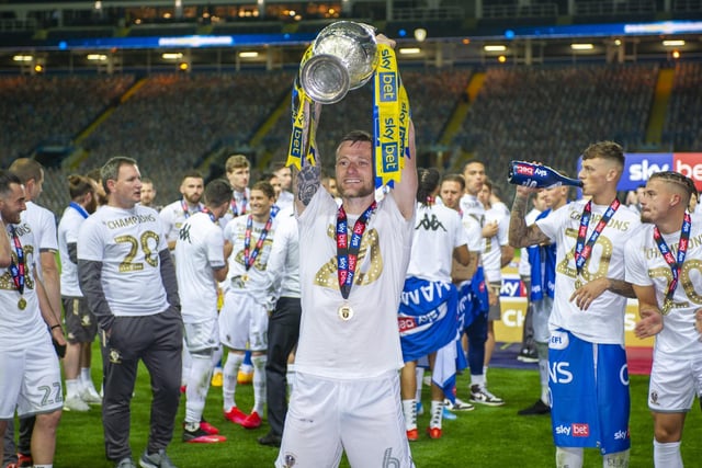 Liam Cooper lifts the championship trophy at Elland Road, winning the division and promoted to the Premier League.