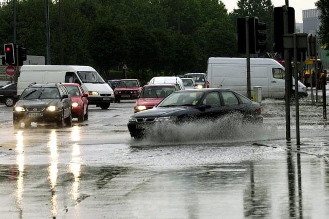 Drivers battle through the floods on Kirstall Road in Leeds.