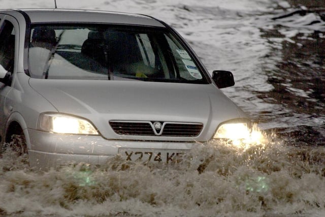 A car negotiates the flood that brought traffic to a stand still on the Inner Ring Road.