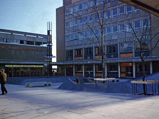 Queen's Court in the heart of Seacroft Shopping Centre in the late 1960s. Woolworths is on the left and Sovereign House offices on the right with the Sovereign pub on the ground floor.