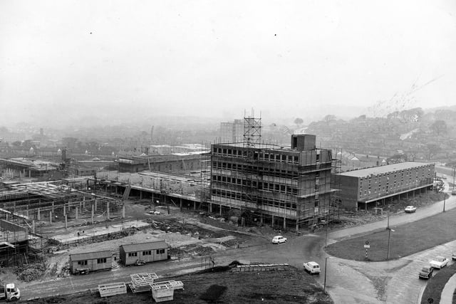 Construction work is well underway in June 1964.