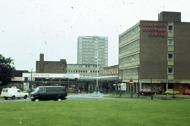 A fish and chip restaurant is on the left with Crown House offices on the right. The tower block in the background is Queensview flats. This photo dates to 1977.