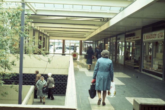 This phiotos from 1977 shows shops including E. Bradley Ltd., furniture and carpets, on the right.