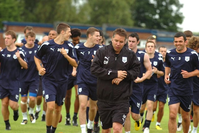 Darren Ferguson leads the Preston players on a run