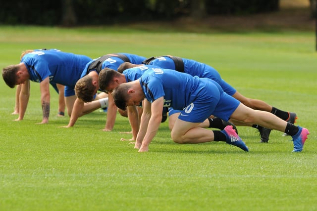 The PNE players stretch out during a training session