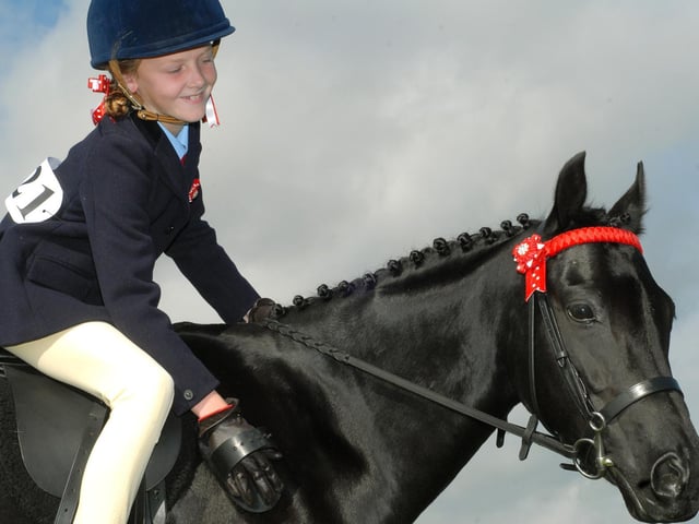Katie Parfitt grooms Lady the horse.