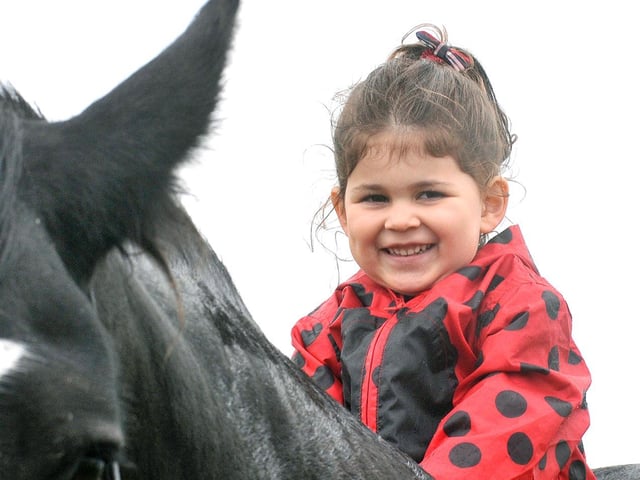 Evelyn-Mae Sanderson sits on Shelly the horse.