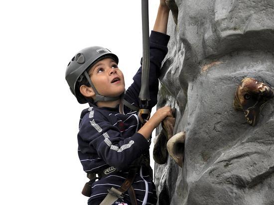Kai Simmons, 8, from Burniston, tries the climbing challenge.