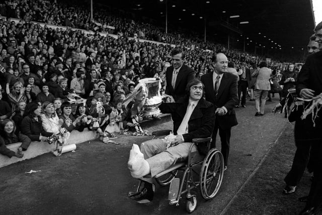 Terry Cooper is wheeled around Elland Road during the FA Cup homecoming celebrations in 1972. He missed the final after breaking his leg.