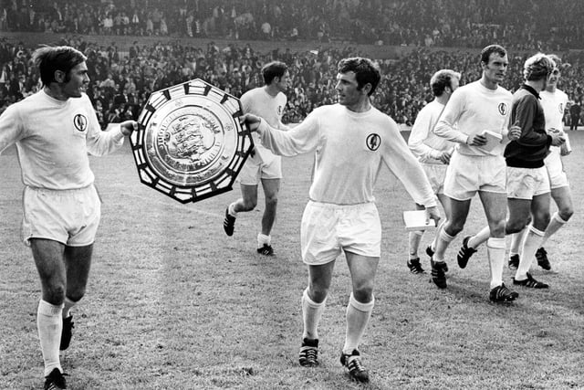 Terry Cooper and John Giles parade the Charity Shield after Leeds United beat Manchester City 2-1 at Elland Road in August 1969.