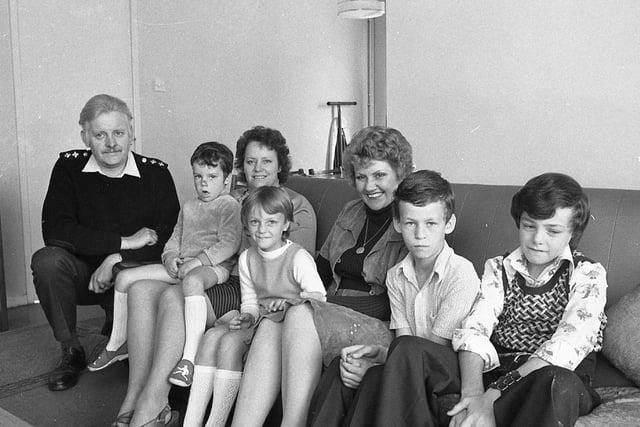 Very soon 100 removal vans will have arrived outside 100 homes in a Fylde village - and part of a family will be on the move. The family is the Army; to be exact, the 1st Battalion Gloucester Regiment. It is exchanging the peace of the Fylde countryside at Elswick for the strain of strife-torn Ulster. Pictured is Families Officer Lt Stephen Gaunt with Army wives Mrs Pam Jones, her four children Andrew, Marie, Alan and Martin, and Mrs Janet McDonald