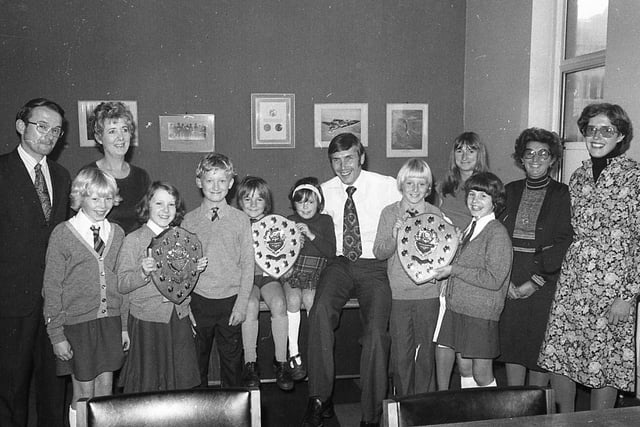 Prizewinning young journalists and their teachers saw the newspaper being printed before their prizes in the Silver Jubilee newspaper contest were handed over by "Post" editor Mr Barry Askew. Pictured: Barry Askew, with Mr D Shone and Mrs D Sully, with children from St John's Primary, Lytham - Catherine Willasey, Kelsey Wood and Christopher Darley; Mrs Marjorie Rollston (head) and Mrs Susan Duke with Scott Newton and Catherine Rigby from Devonshire infants; and Mrs J Nettleship with Joan Hindle of Longton junior school
