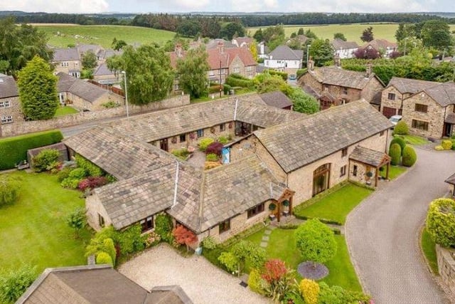 This five-bedroom home has been created from a range of period barns to produce a unique home set around a totally private central courtyard garden with swimming pool.
