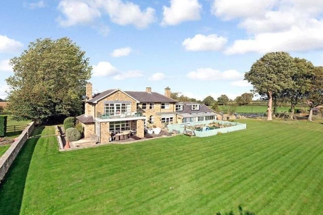 This six-bedroom property is set amidst formal gardens and paddocks of approximately nine acres and is only seven miles from Leeds city centre.