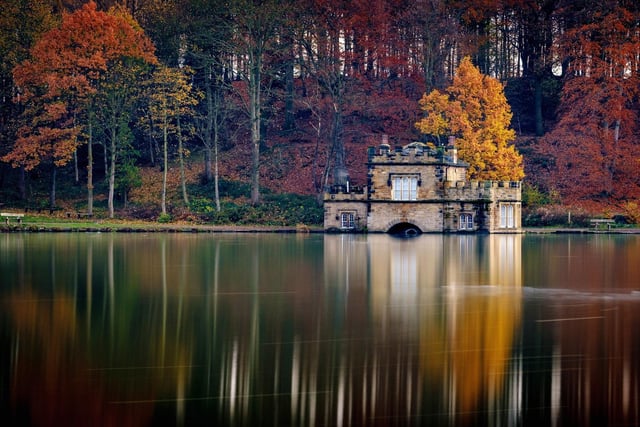 The boathouse reflected in the lake at Newmillerdam near Wakefield