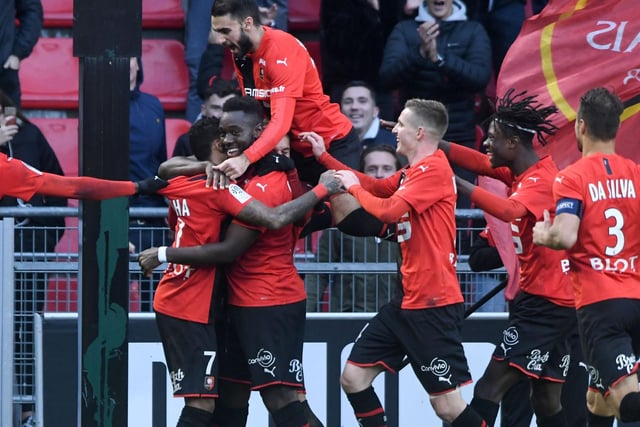 MOBBED: Raphinha, second left, is pounced upon by his team mates after scoring for Rennes against Amiens in December 2019. Photo by JEAN-FRANCOIS MONIER/AFP via Getty Images.