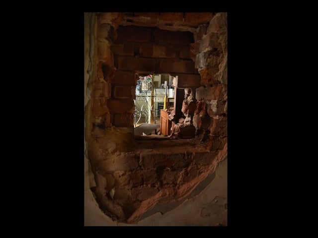 The hole made in the wall of the Plug and Taps, which allowed access to the jewellers