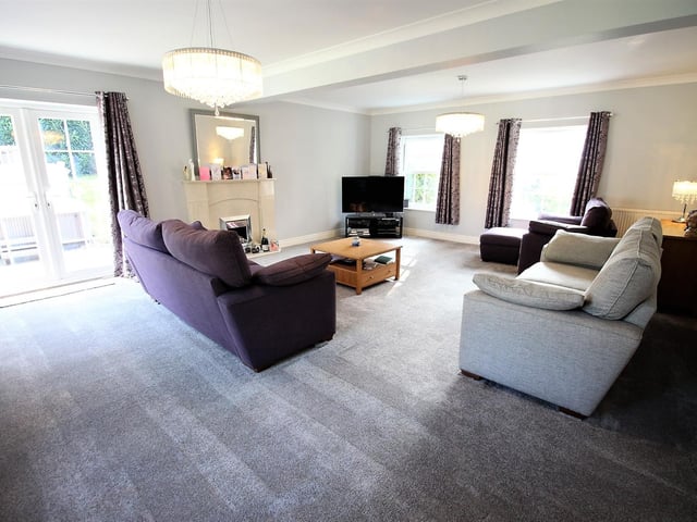 Large windows flood the living room with light