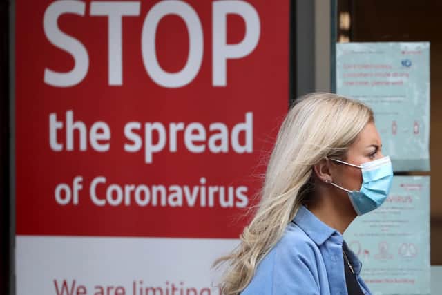 Stock photo of a woman wearing a face mask. Photo: PA