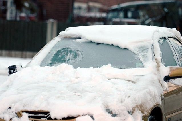 Snow on cars in Preston