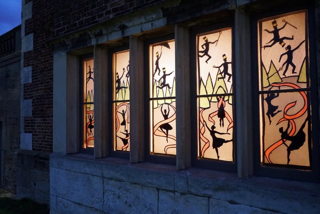 The 500-year-old windows are now covered in images created by one of the house’s visitor assistants.