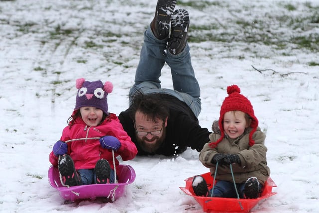 17th January 2016 - Gareth Jones from Swinley enjoys the snow with his children Maisie, four, and Betsy, two, at Mesnes Park, Wigan.