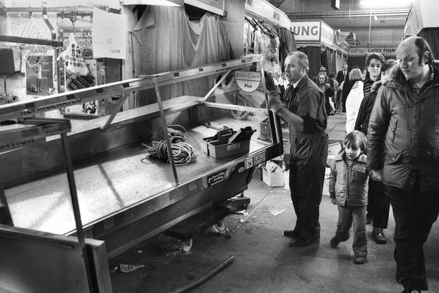 Saturday 16th January 1988 - Frank King's butchers stall fittings are removed on the last day of trading in Wigan Market Hall.