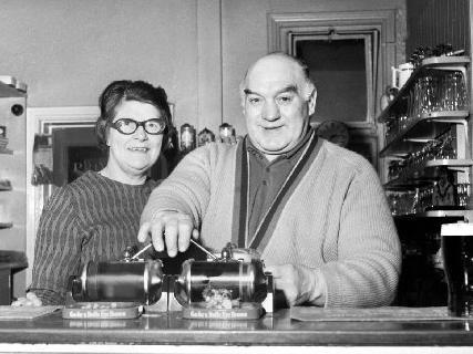 Tuesday 15th January 1974 - Former Wigan Rugby League great, Ken Gee, pulls his last pint with wife, Margaret, as he retires as landlord of the Railway Hotel in Pemberton.