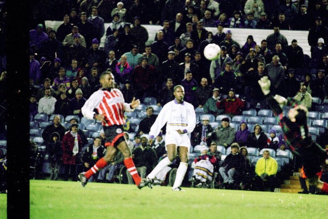 Phil Masinga completes his hat-trick by curling the ball around Walsall goalkeeper Trevor Wood from 15 yards out.